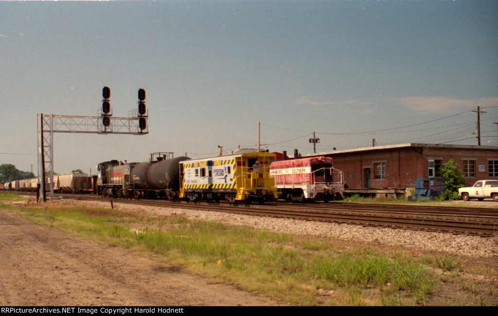 CSX 1186 pushes a train north, past the signals at Charlie Baker and NCYR train